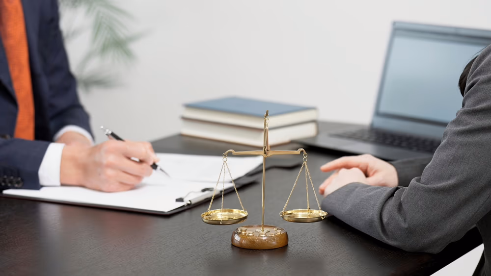 Attorney taking a statement from a woman filing a sexual harassment claim